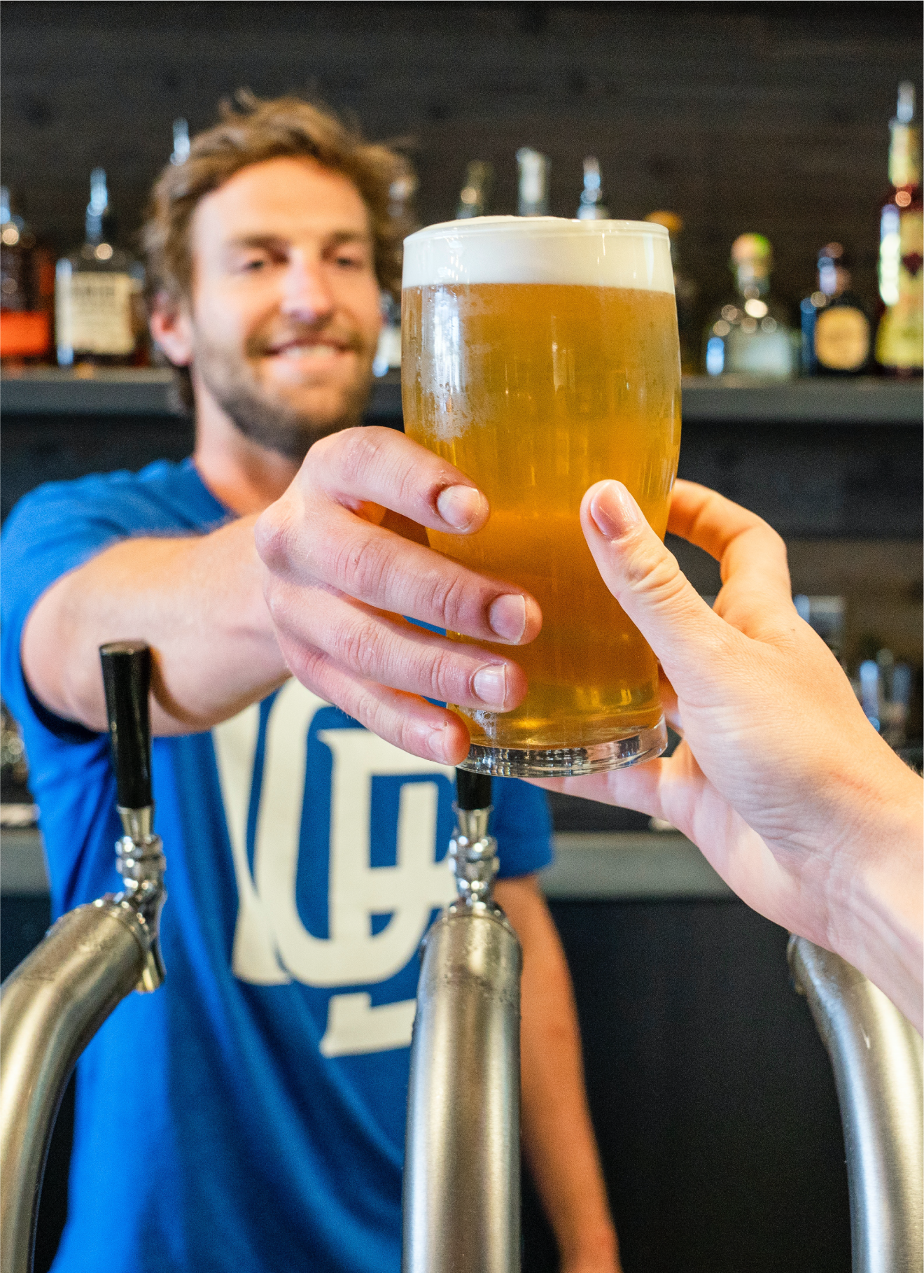 bartender serving a beer
