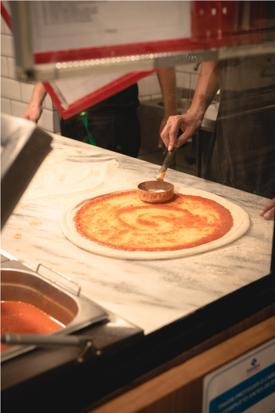 pizza chef making a pizza