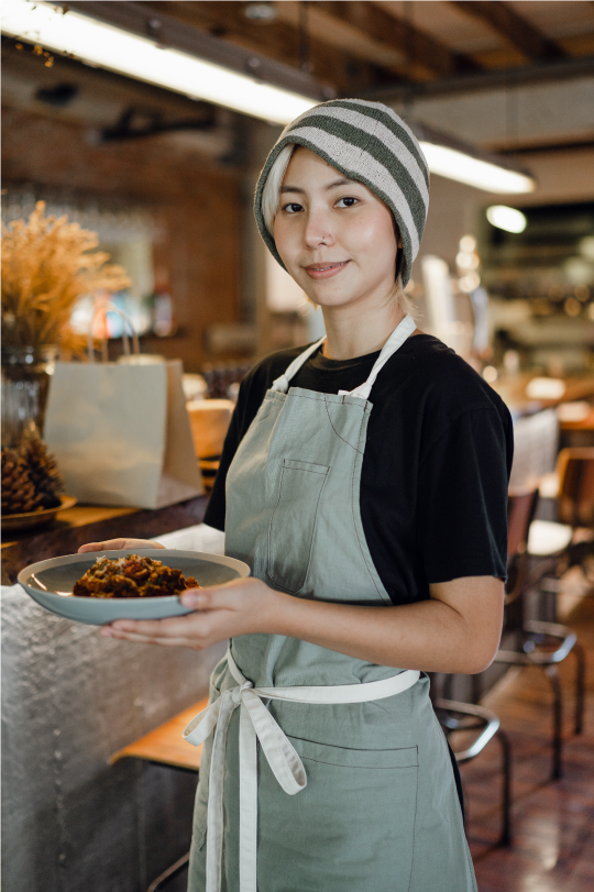 restaurant employee holding a dish